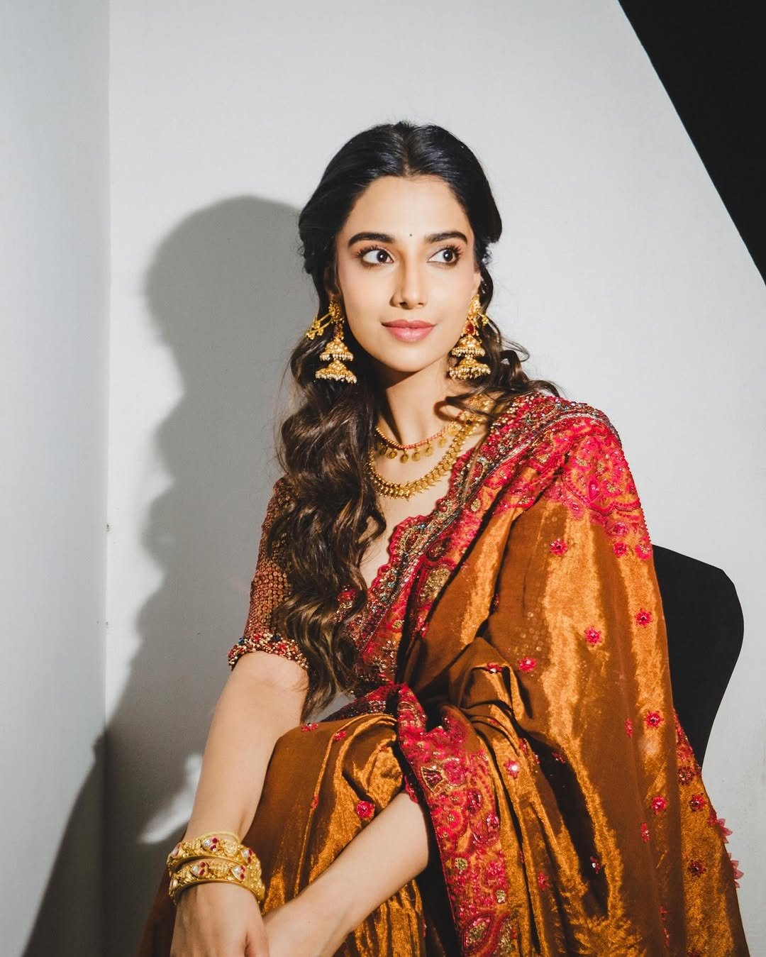 Meenakshi Chaudhary Stunning Red Saree Photos 2026 trending celebrity photos