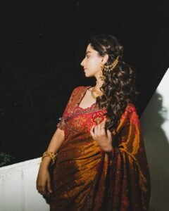 Meenakshi Chaudhary Stunning Red Saree Photos 2026 trending celebrity photos