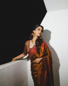 Meenakshi Chaudhary Stunning Red Saree Photos 2026 beautiful outfit images