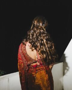 Meenakshi Chaudhary Stunning Red Saree Photos 2026 stunning fashion look