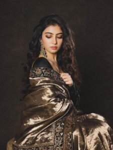 Sara Arjun Looks Stunning in Elegant Black and Gold Saree trending celebrity photos