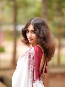 Yashu Looks Elegant in White Saree with Maroon Blouse stunning fashion look