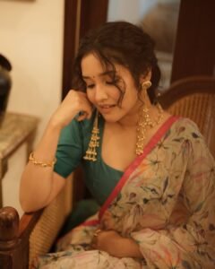 Anikha Surendran Looks Graceful in Floral Saree and Teal Blouse Photos (12)