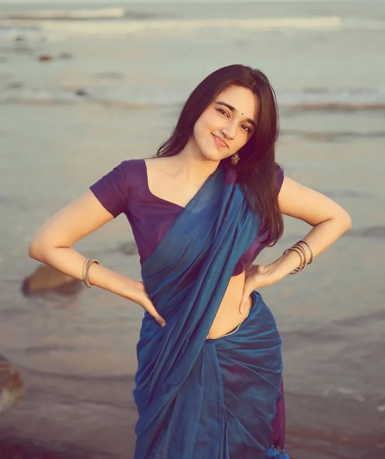 Nuveksha Looks Charming in Elegant Blue Saree Beach Photos (1)