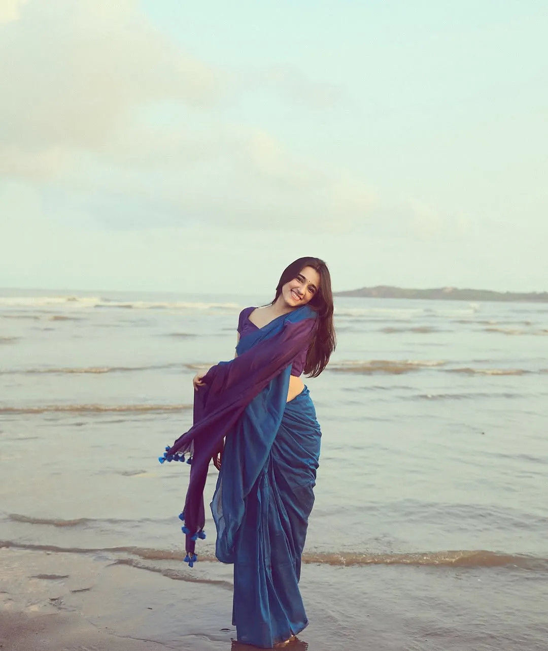 Nuveksha Looks Charming in Elegant Blue Saree Beach Photos (11)