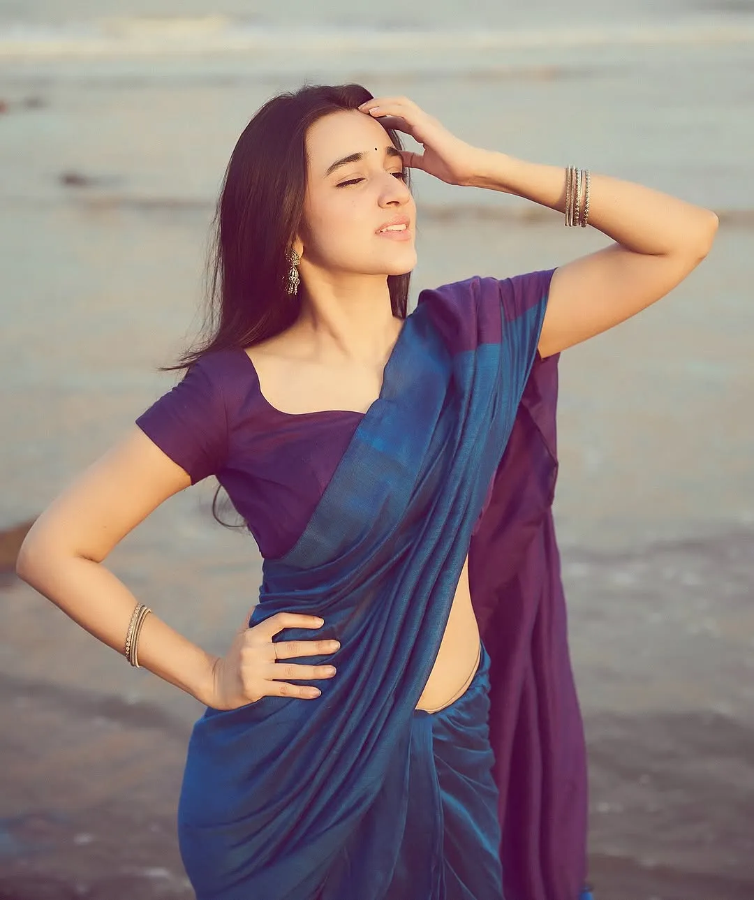 Nuveksha Looks Charming in Elegant Blue Saree Beach Photos (2)