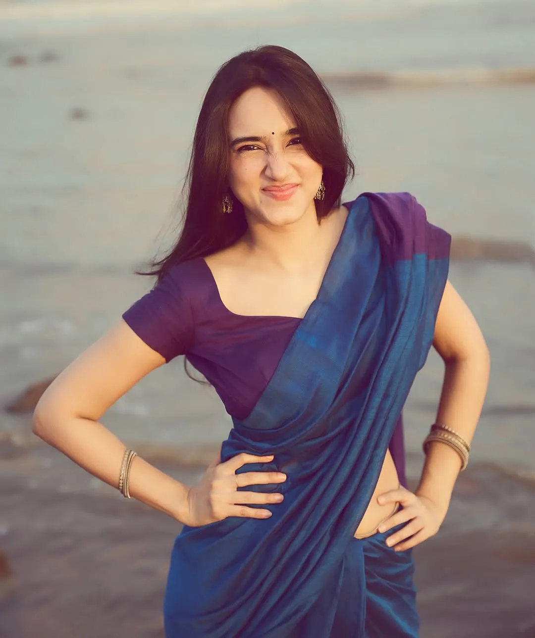Nuveksha Looks Charming in Elegant Blue Saree Beach Photos (3)